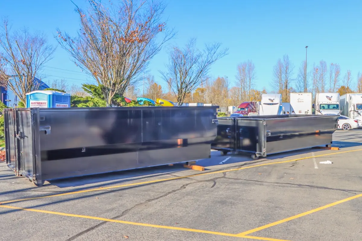 Professional dumpster rental service with roll-off container on residential driveway in Santa Teresa